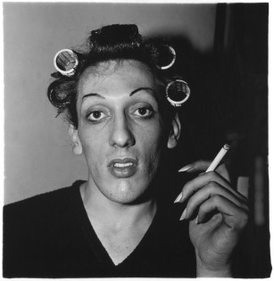 A young man in curlers at home on West 20th Street, N.Y.C., 1966. © The Estate of Diane Arbus
